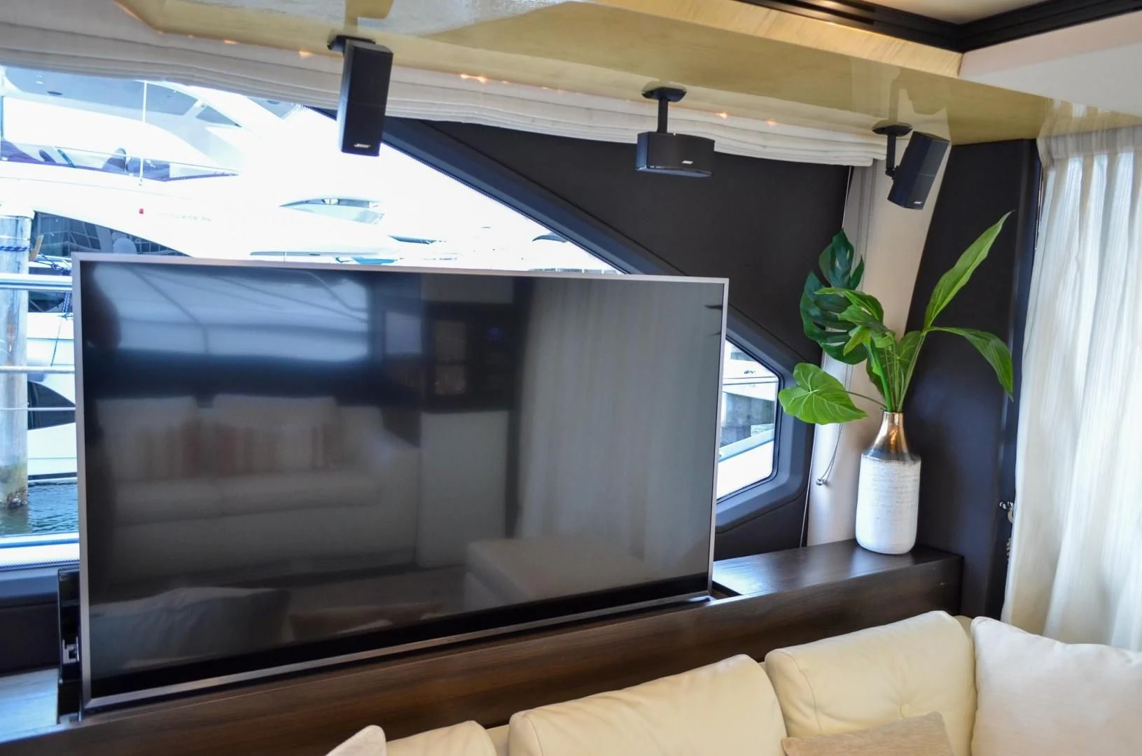 a large television in a room aboard CERULEAN Yacht for Sale