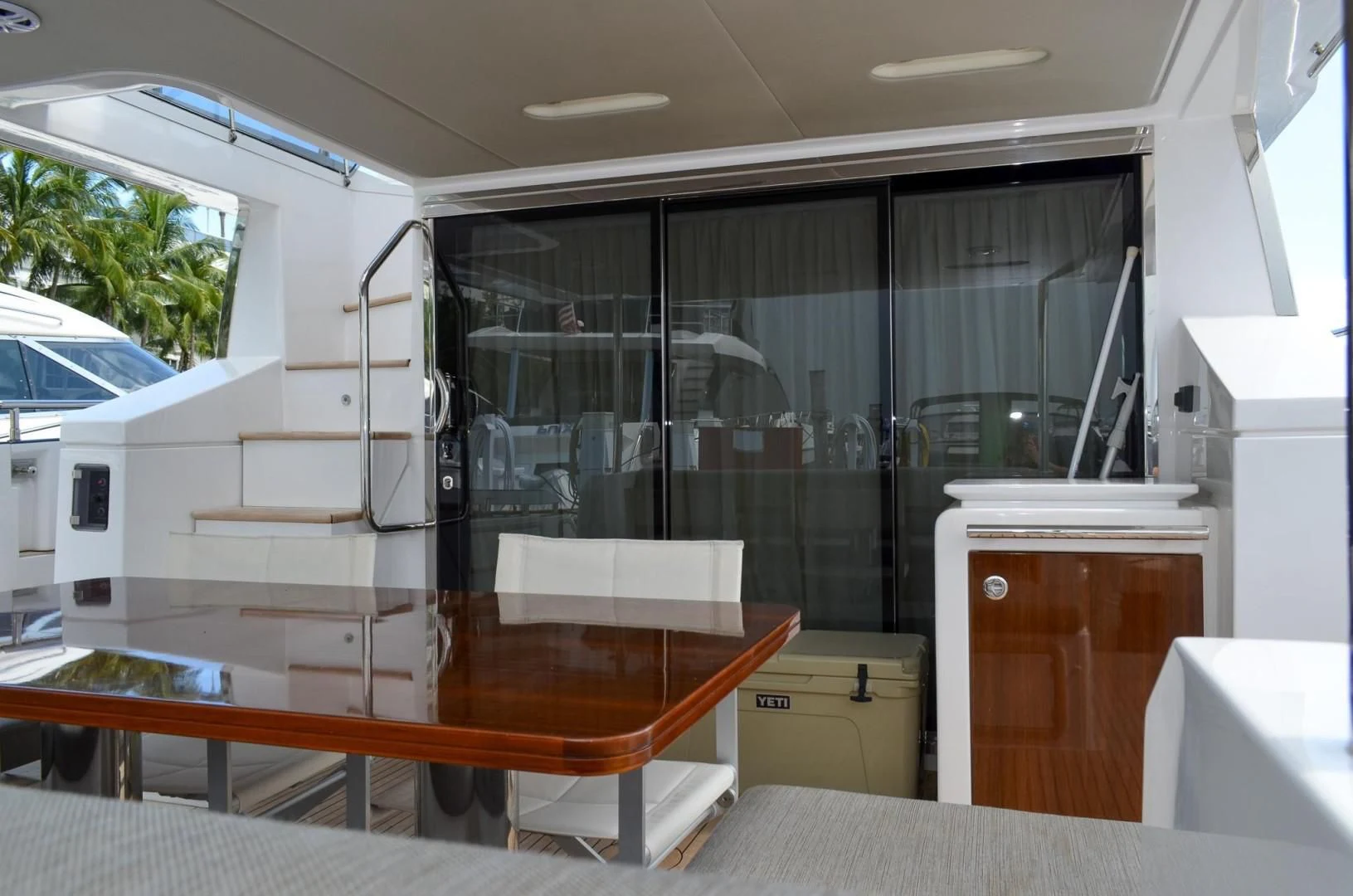 a room with a table and a window aboard CERULEAN Yacht for Sale