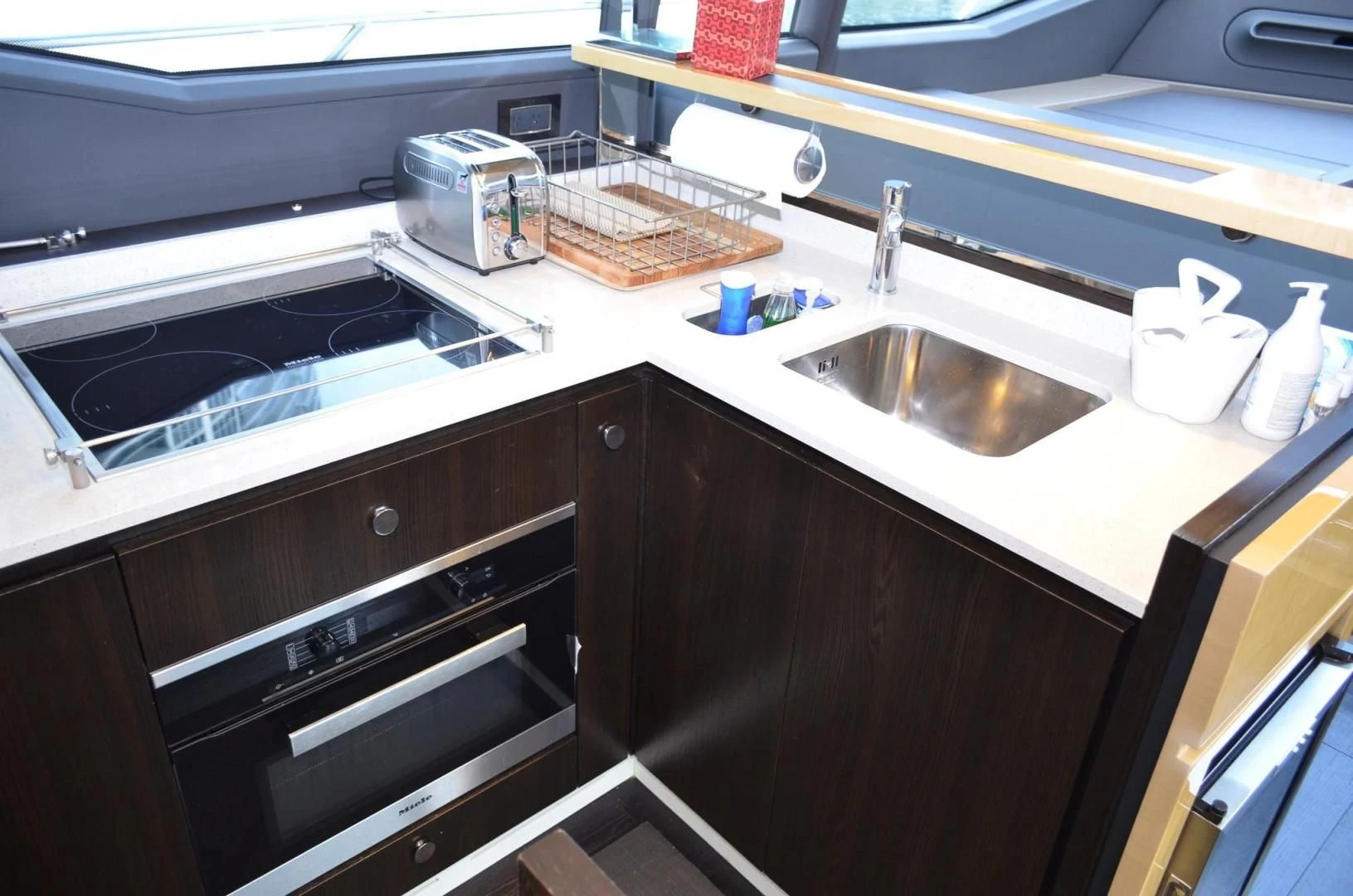 a kitchen with a sink and a basket on the counter aboard CERULEAN Yacht for Sale