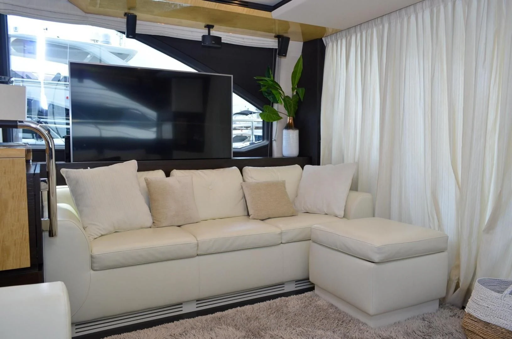 a white couch in a room aboard CERULEAN Yacht for Sale