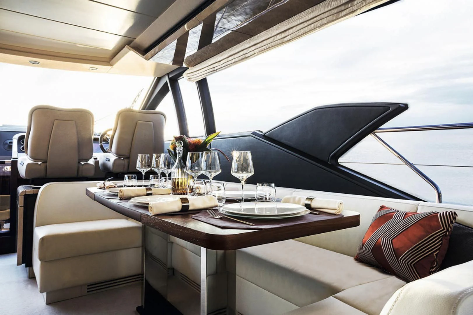 a table with glasses and plates on it aboard CERULEAN Yacht for Sale
