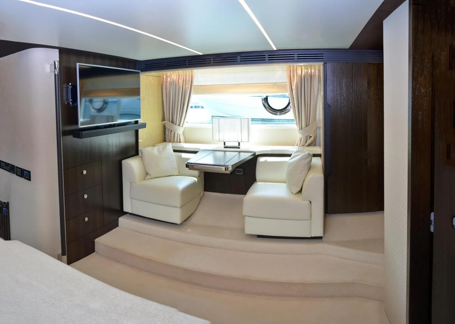 a room with a bed and a desk aboard CERULEAN Yacht for Sale