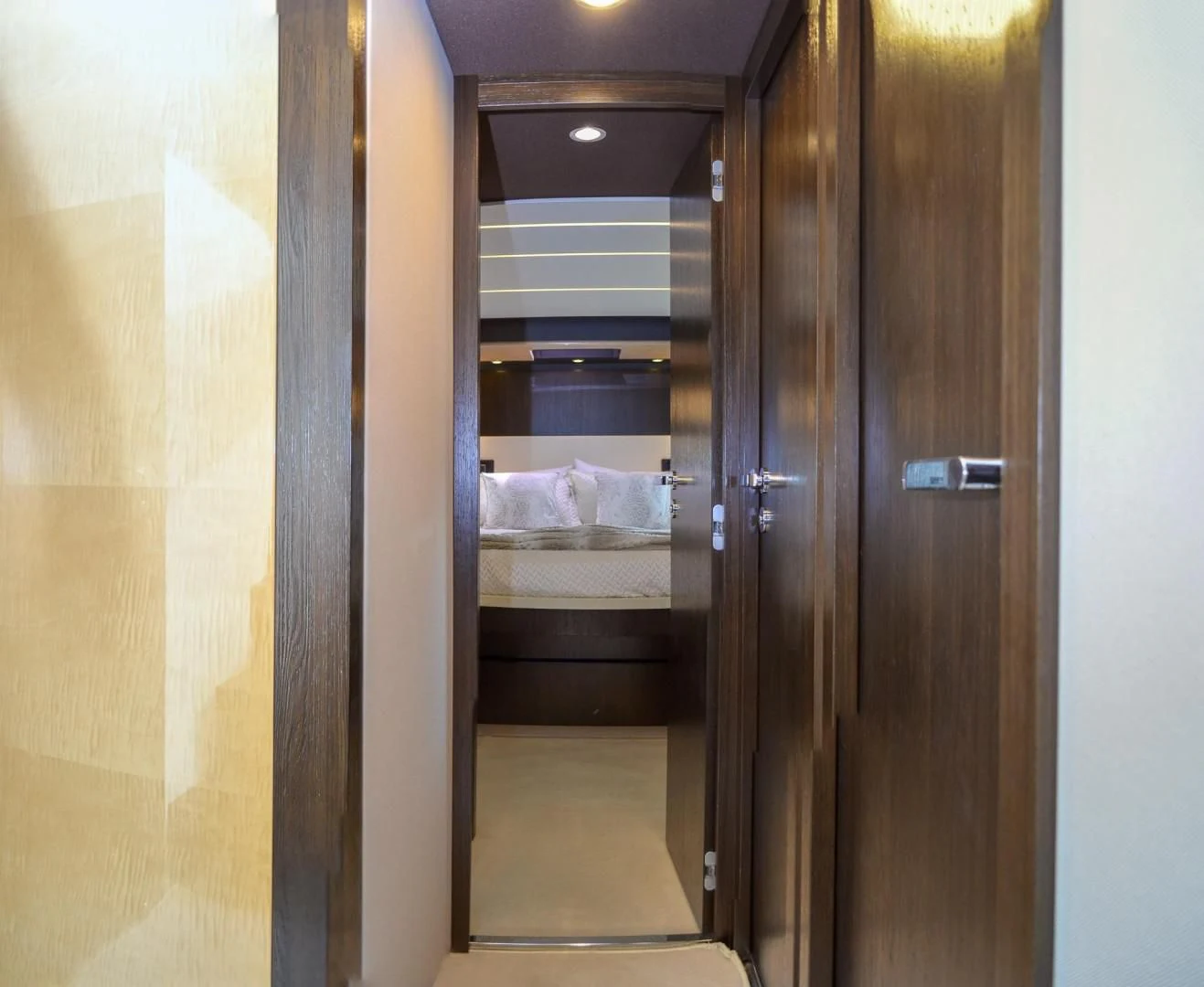 a room with a bed and a closet aboard CERULEAN Yacht for Sale