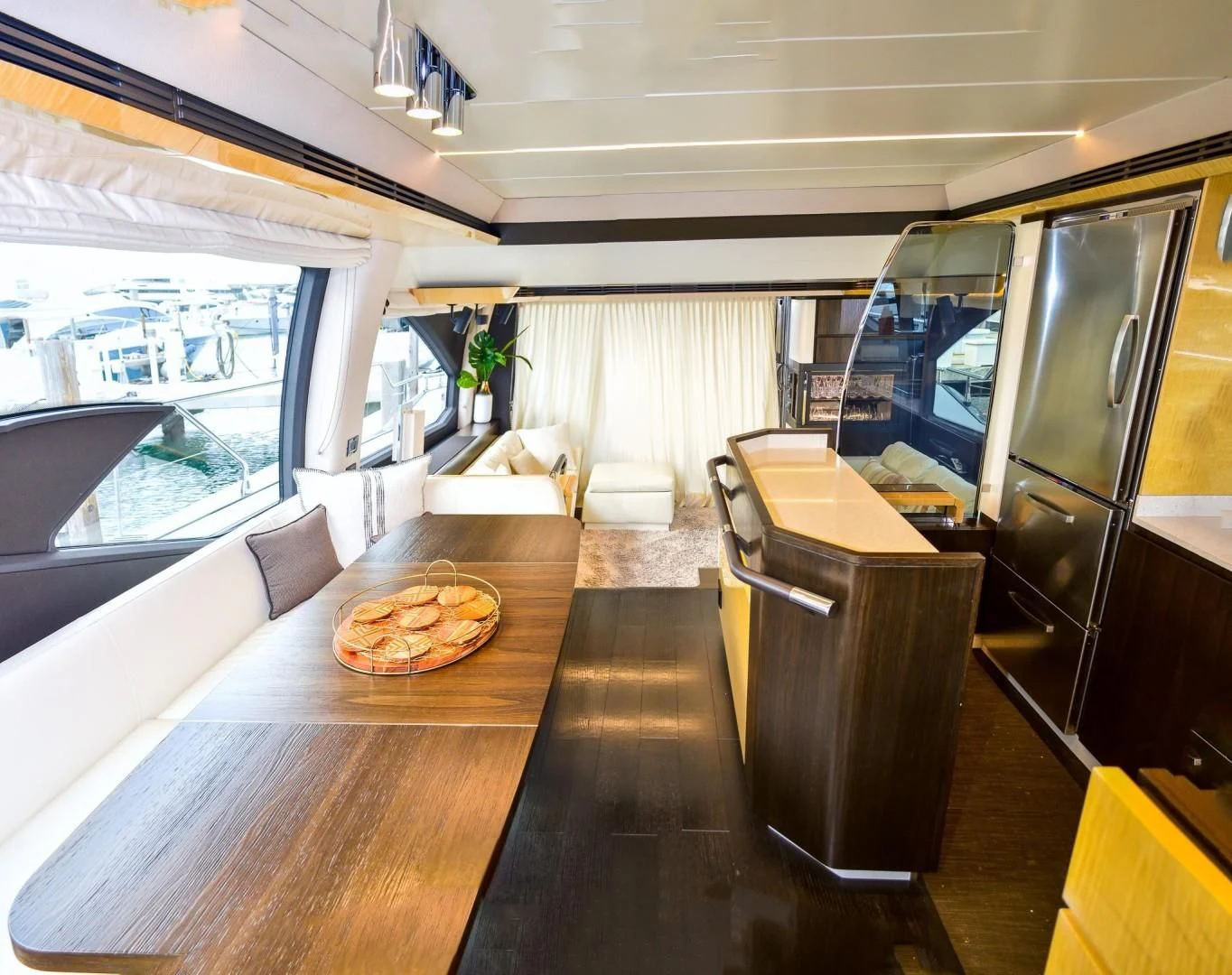 a living room with a wood table aboard CERULEAN Yacht for Sale