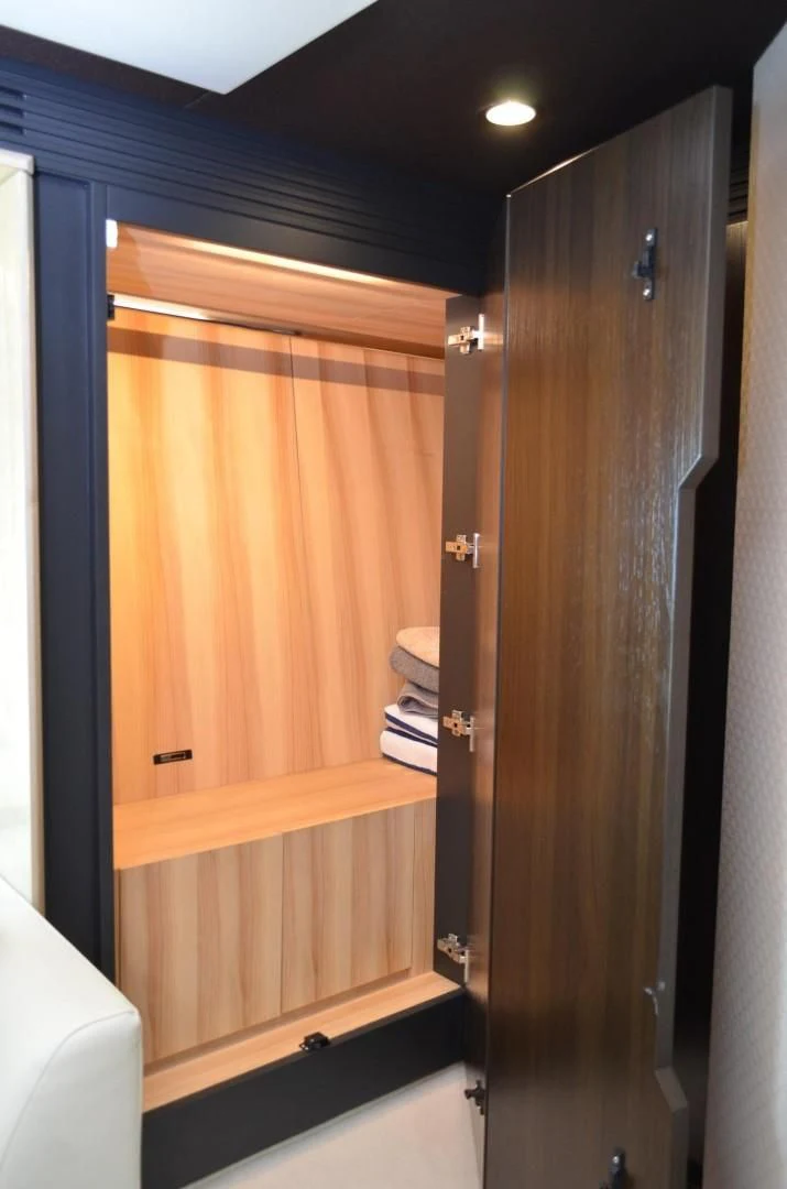 a wooden closet with a wood door aboard CERULEAN Yacht for Sale