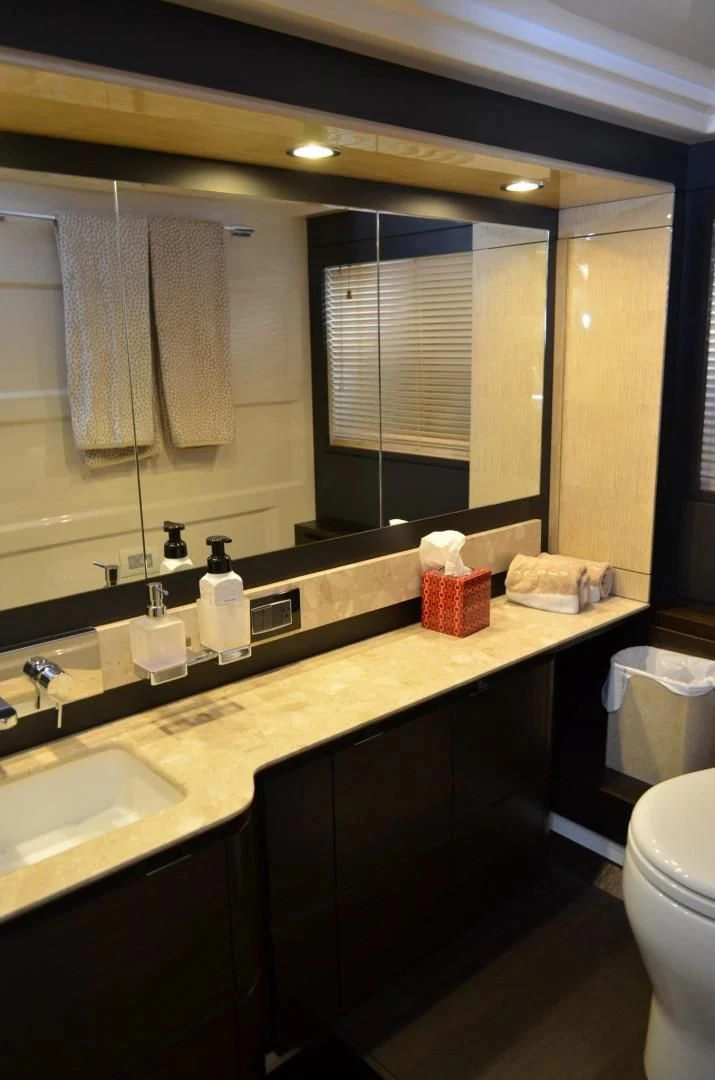 a bathroom with a large mirror aboard CERULEAN Yacht for Sale