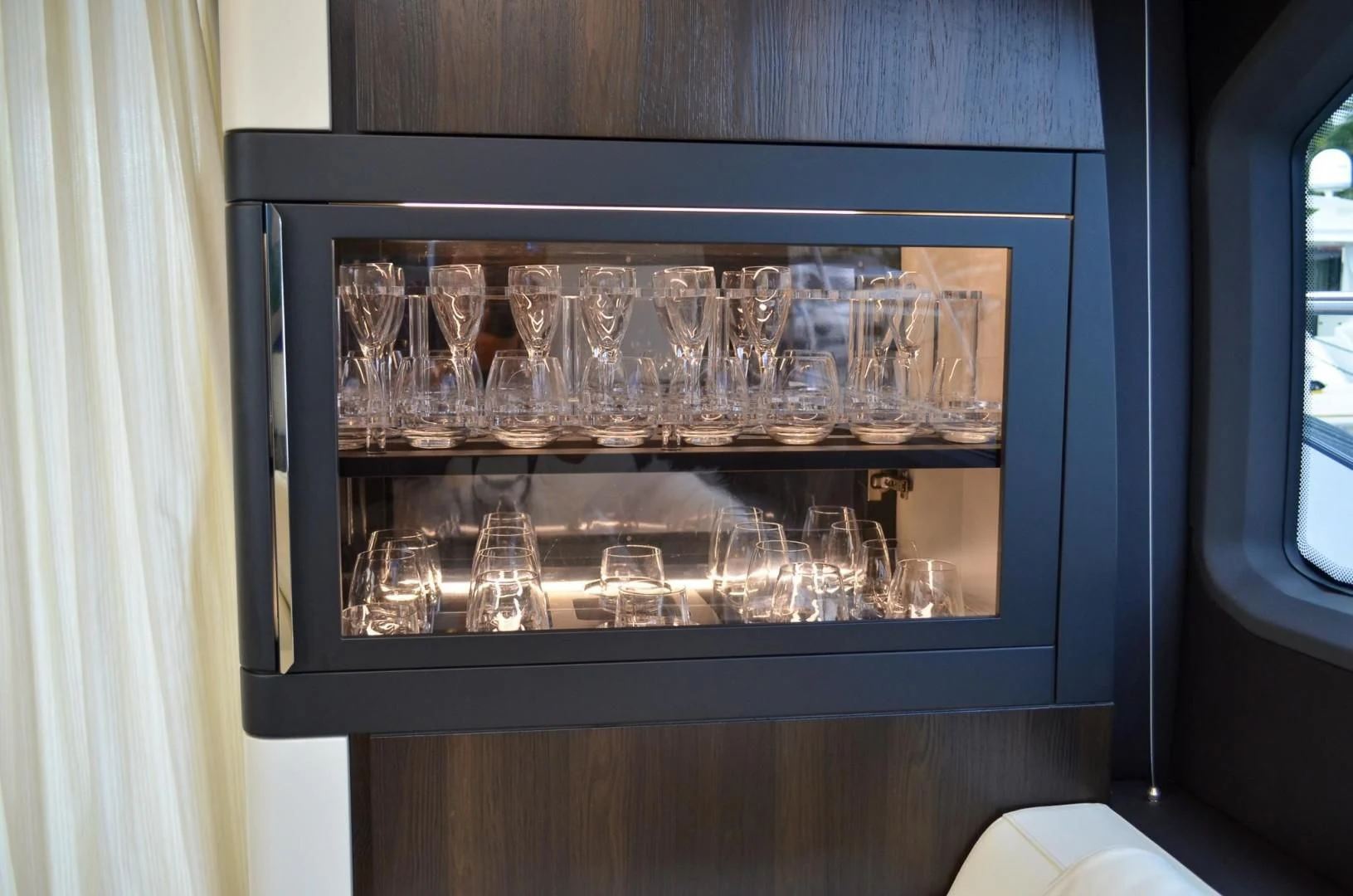 a group of glasses on display aboard CERULEAN Yacht for Sale