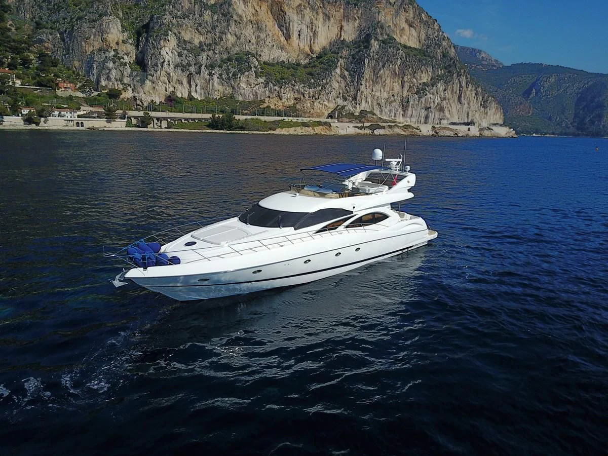 a white boat in the water aboard NIKA Yacht for Sale