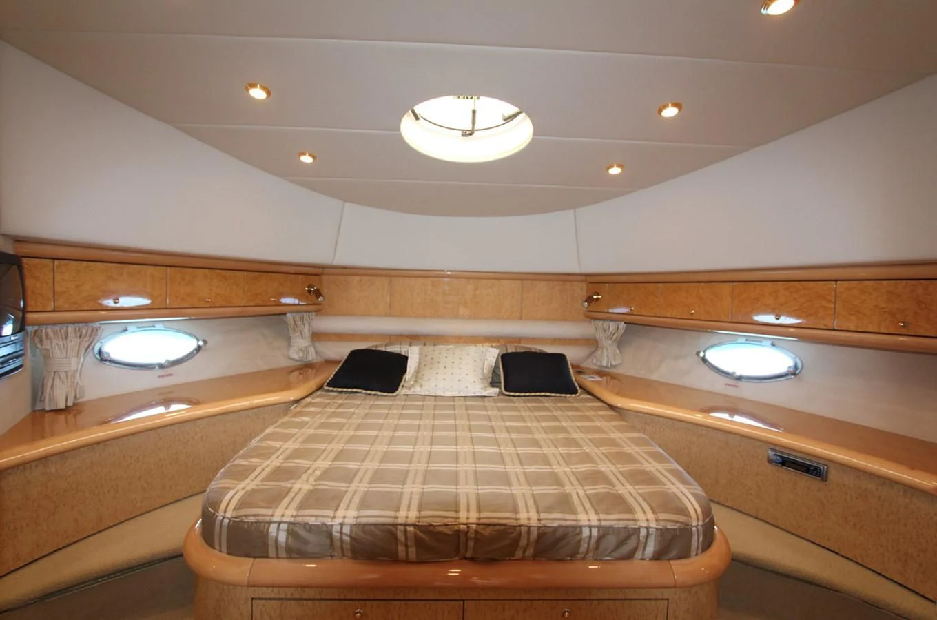 a room with a bed and a sink aboard NIKA Yacht for Sale