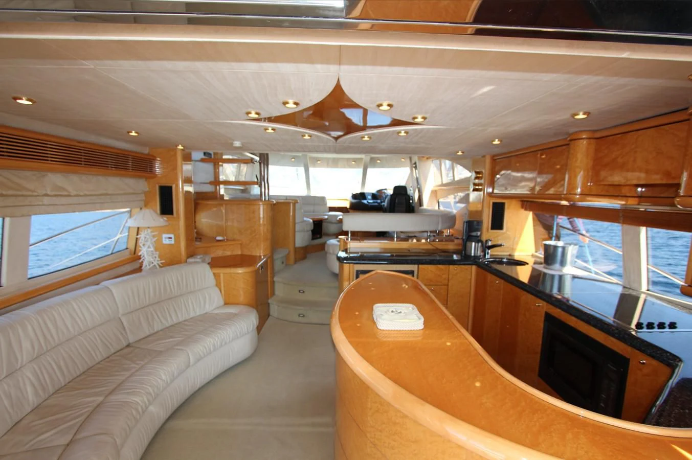 a room with a couch and a table aboard NIKA Yacht for Sale