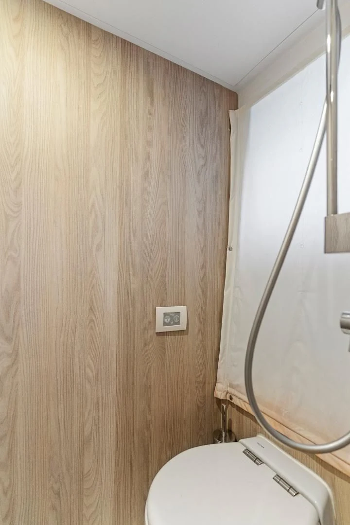a toilet with a shower head aboard ANONYMOUS Yacht for Sale