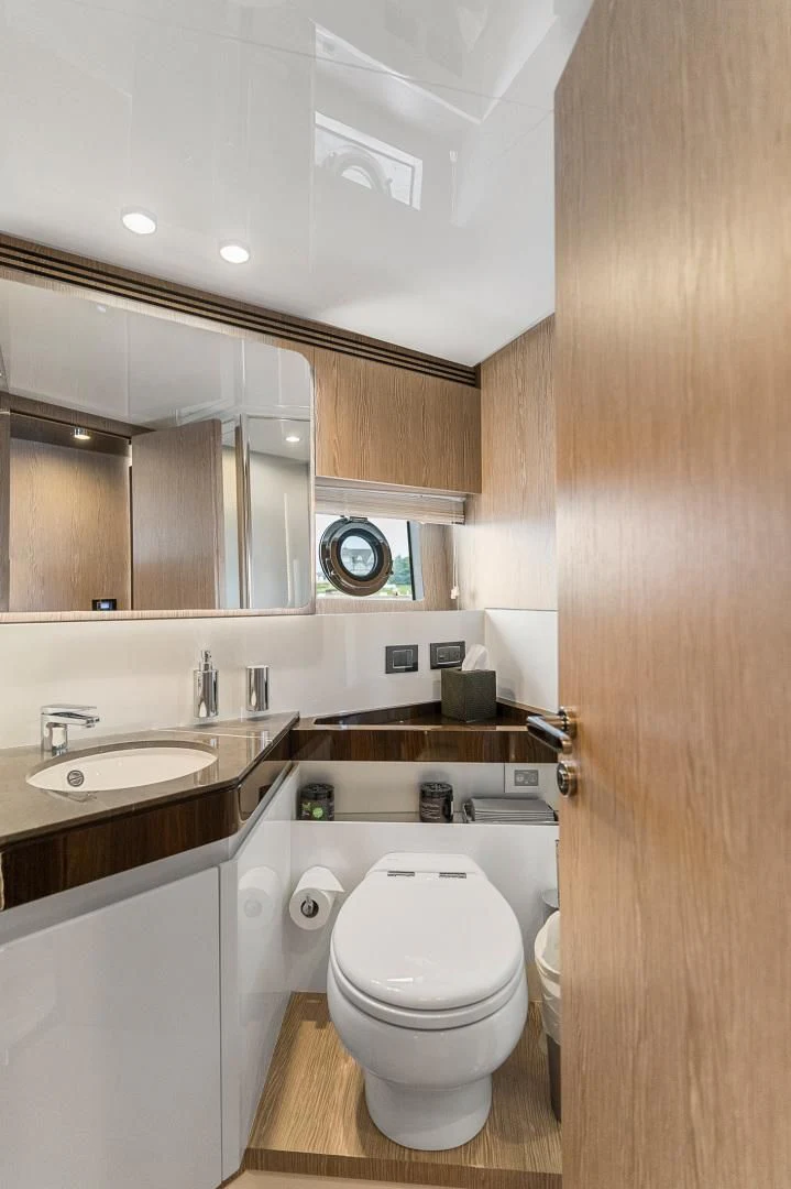 a bathroom with a toilet sink and a mirror aboard ANONYMOUS Yacht for Sale