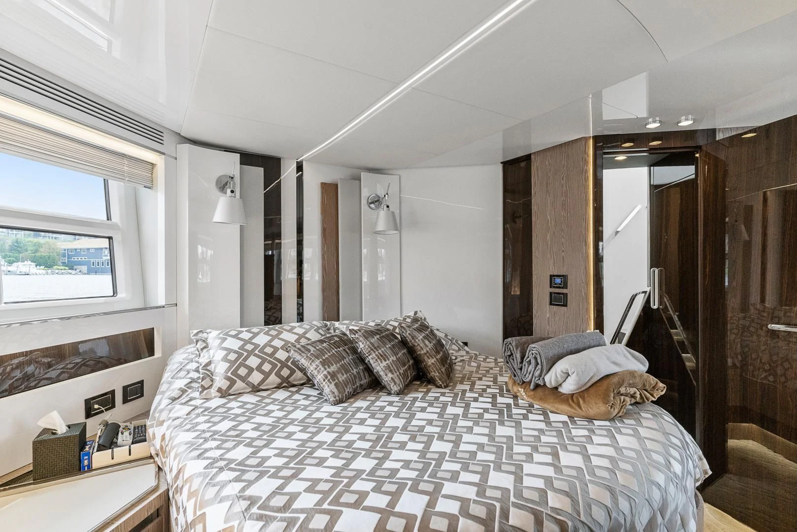 a bedroom with a bed and a mirror aboard ANONYMOUS Yacht for Sale