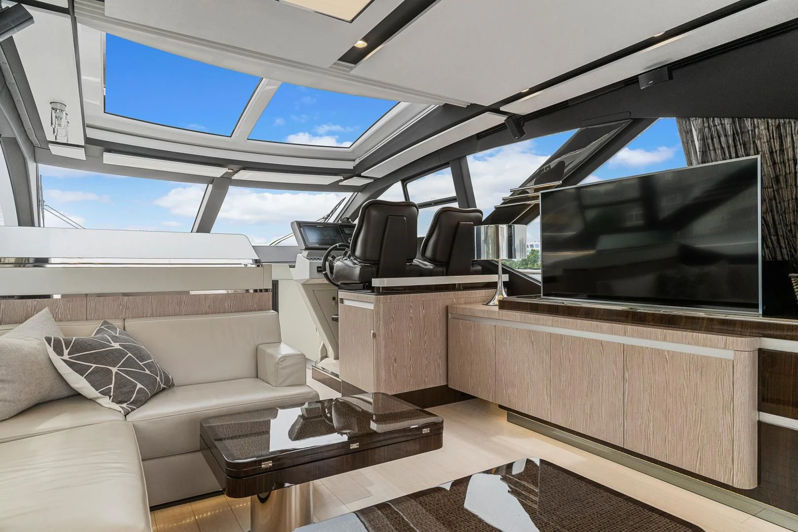 a living room with a large screen aboard ANONYMOUS Yacht for Sale