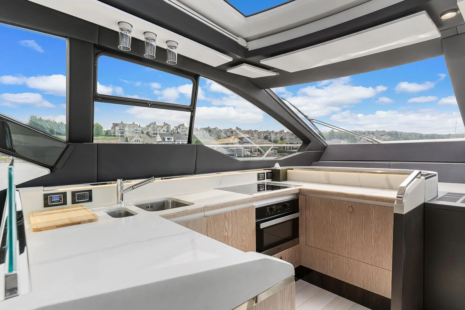 a room with a view of a city and water aboard ANONYMOUS Yacht for Sale