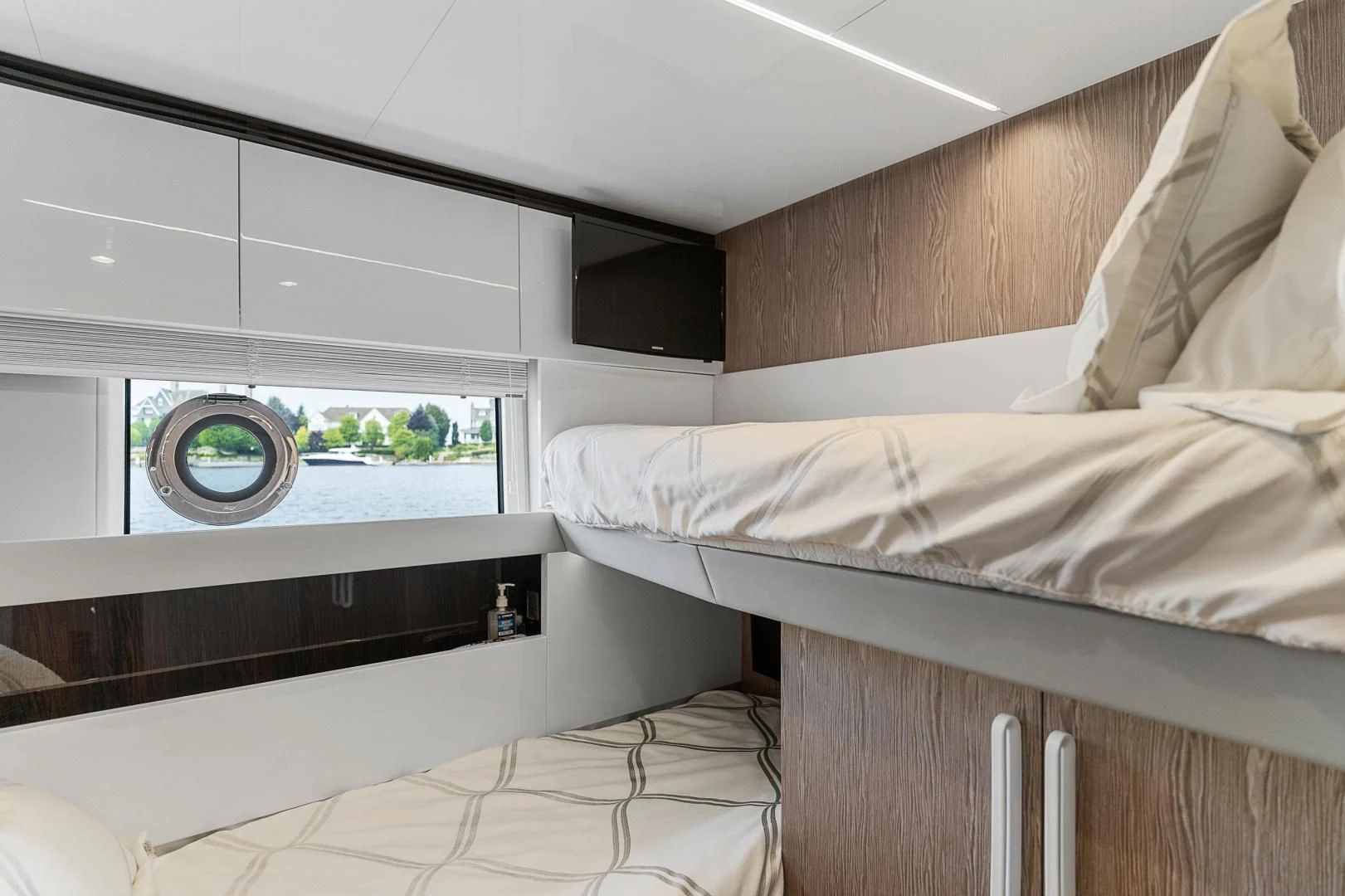 a room with a bed and a television aboard ANONYMOUS Yacht for Sale