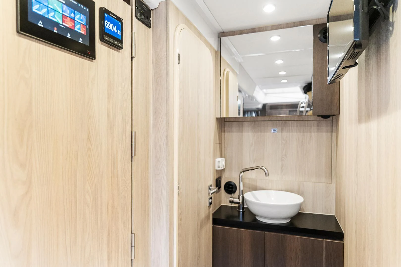 a sink and a television in a room aboard ANONYMOUS Yacht for Sale