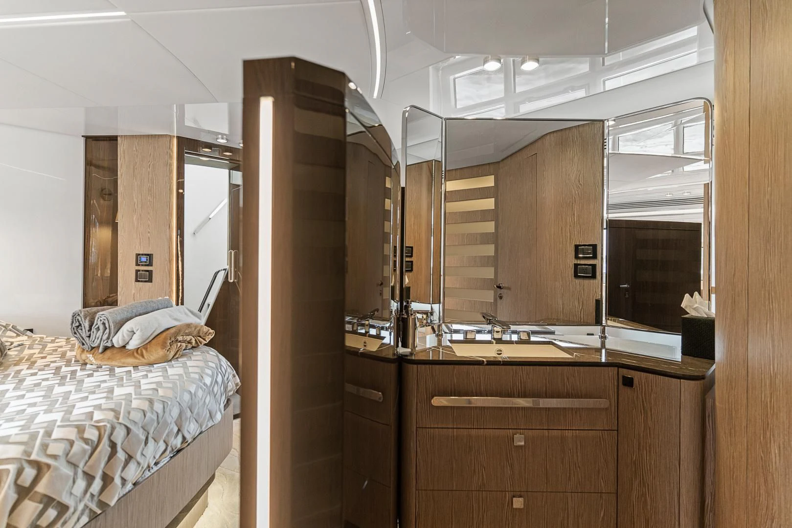 a bedroom with a bed and a mirror aboard ANONYMOUS Yacht for Sale
