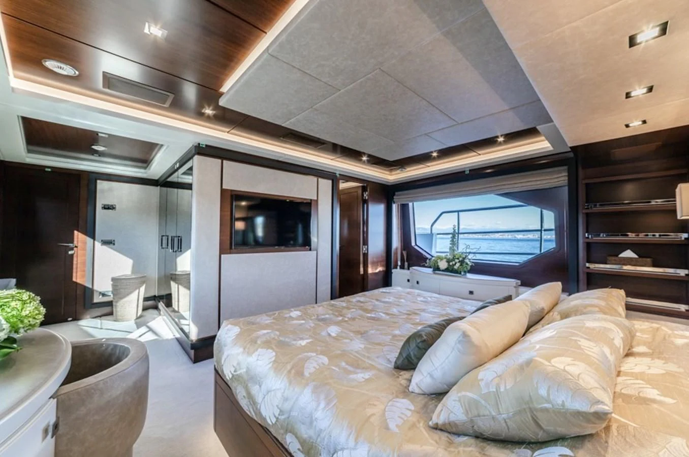 a bedroom with a large bed aboard ADEL Yacht for Sale