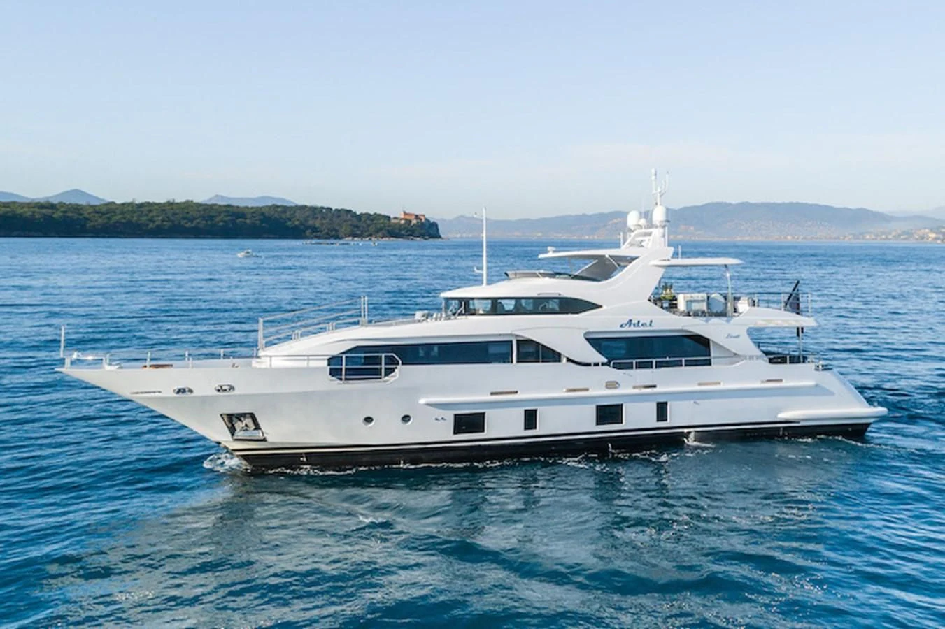 a white yacht in the water aboard ADEL Yacht for Sale