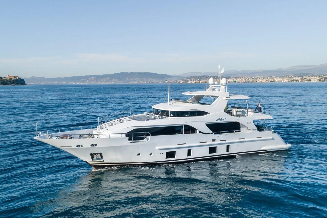 a white yacht in the water aboard ADEL Yacht for Sale