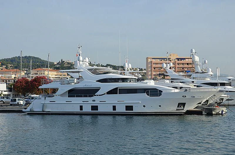 a large white yacht in a harbor aboard ADEL Yacht for Sale