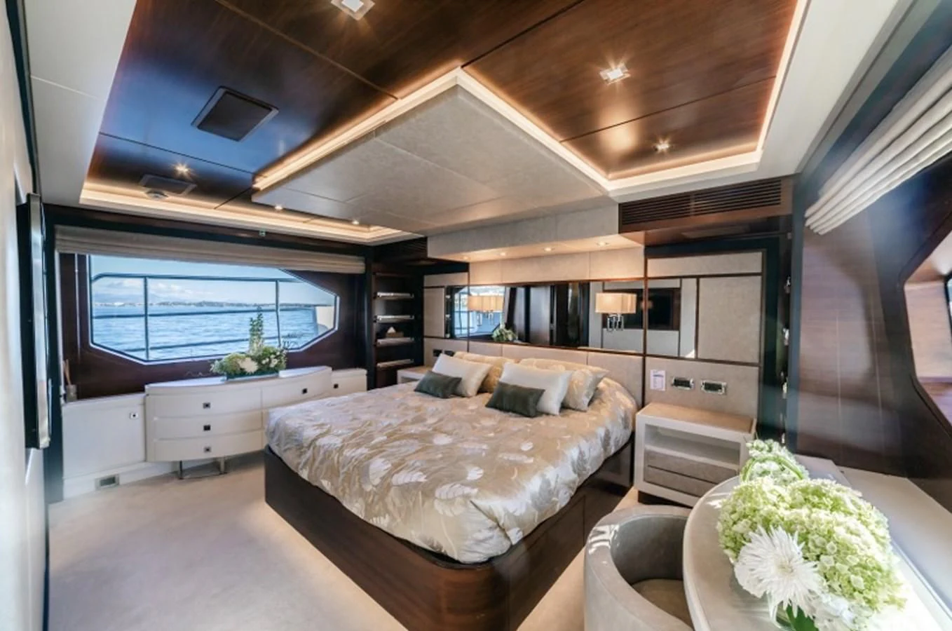 a room with a bed and a large window aboard ADEL Yacht for Sale