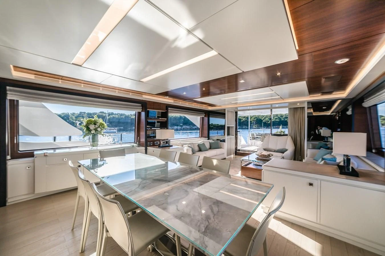 a room with a table chairs and a large window aboard ADEL Yacht for Sale