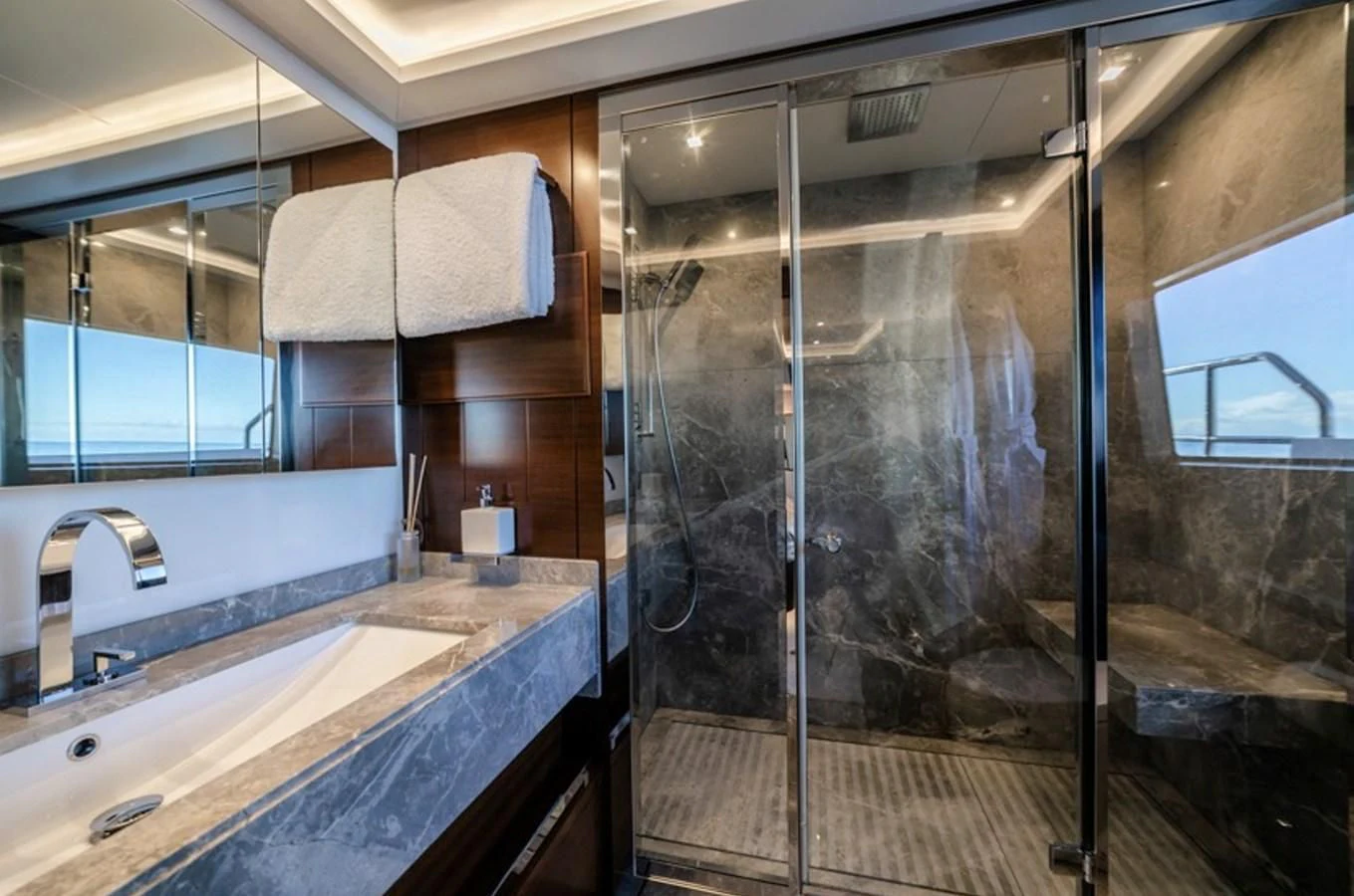 a bathroom with a glass shower aboard ADEL Yacht for Sale