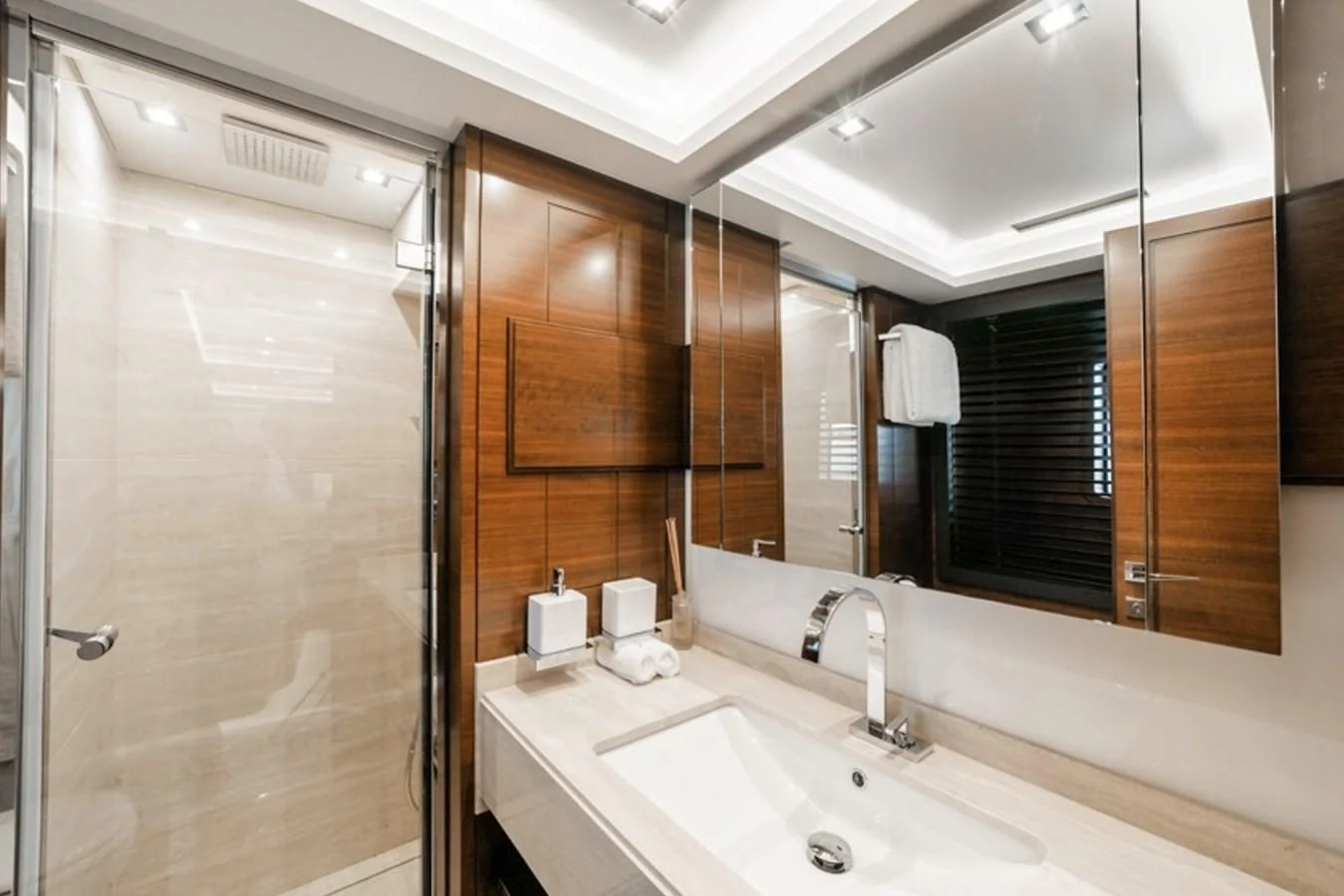 a bathroom with a sink and a mirror aboard ADEL Yacht for Sale