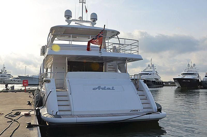 a boat docked at a dock aboard ADEL Yacht for Sale