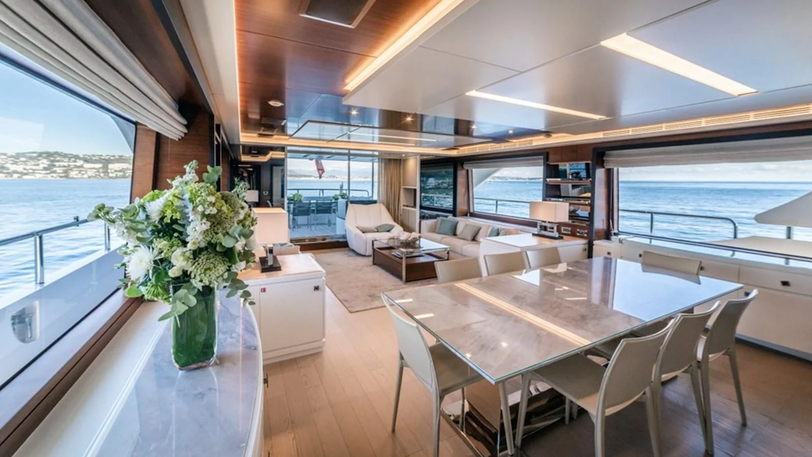 a large open living room with a large window aboard ADEL Yacht for Sale