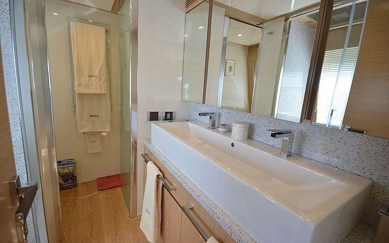 a bathroom with a large mirror aboard DISPARATE Yacht for Sale