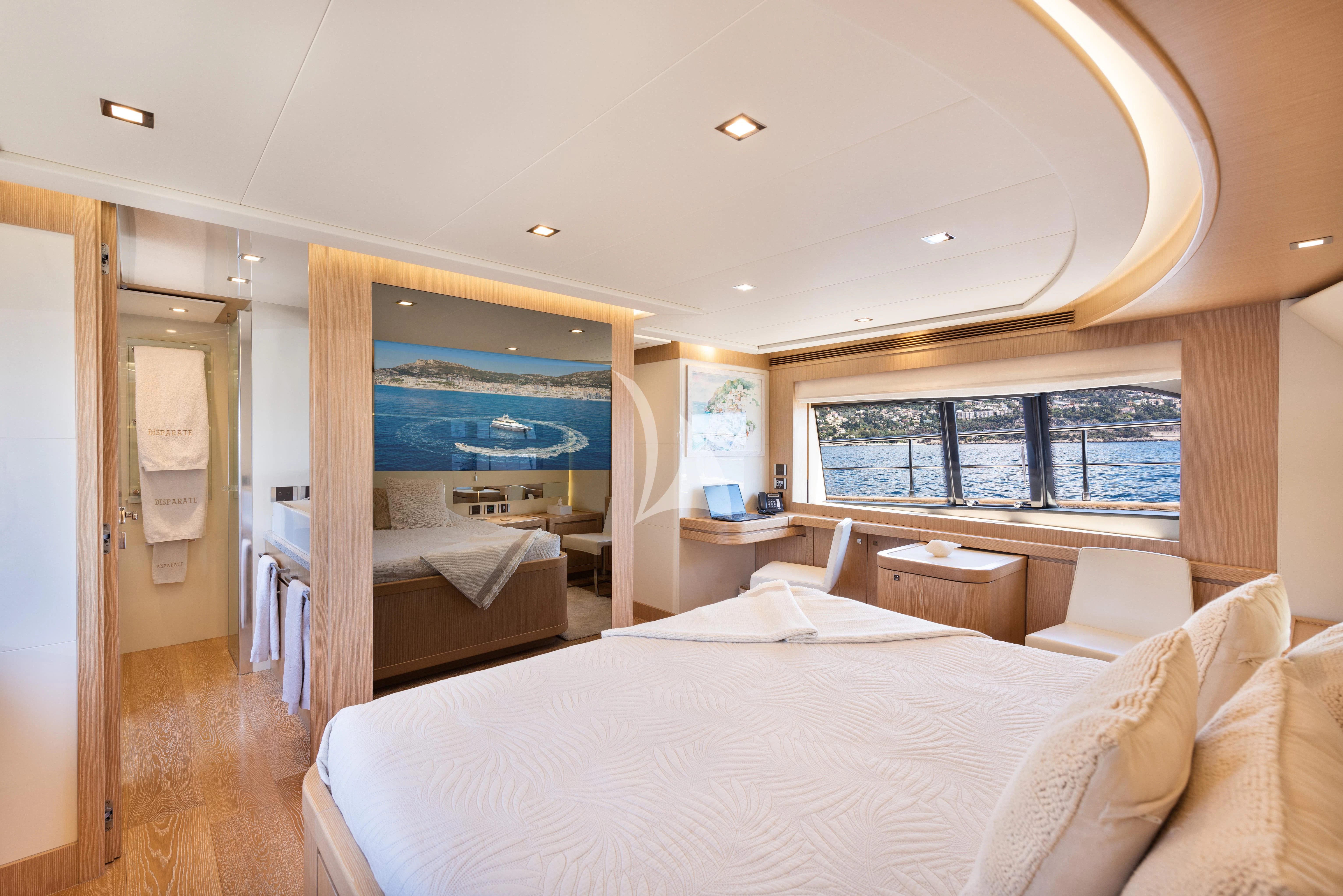 a bedroom with a large bed aboard DISPARATE Yacht for Sale