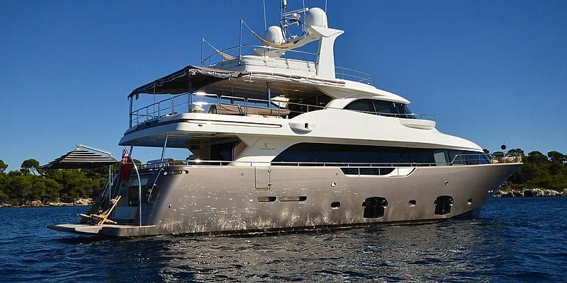 a white yacht on the water aboard DISPARATE Yacht for Sale