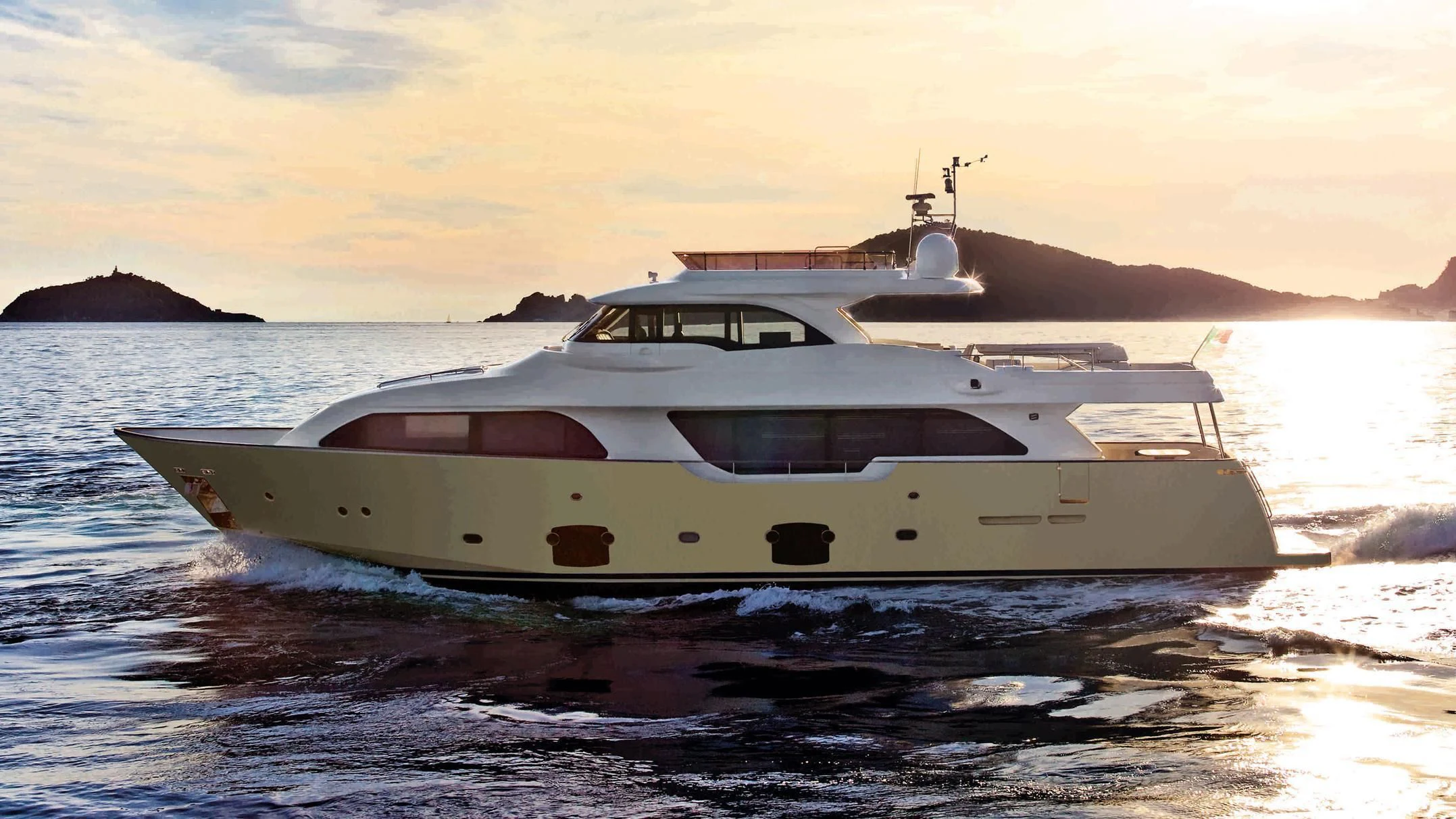 a white boat on the water aboard DISPARATE Yacht for Sale
