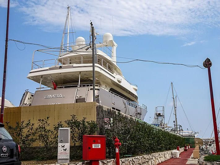 a large ship docked aboard DISPARATE Yacht for Sale