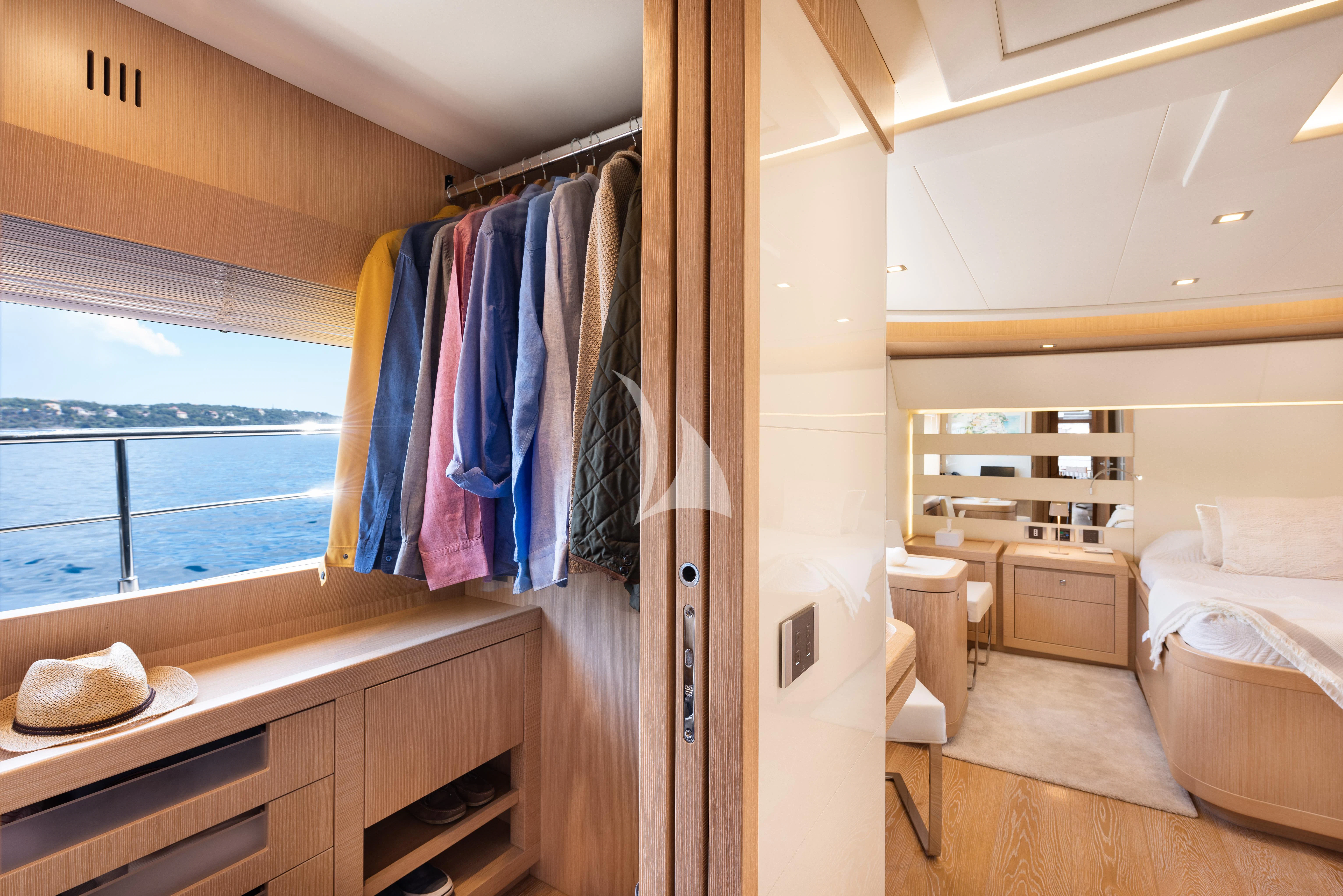 a room with a bed and a closet aboard DISPARATE Yacht for Sale