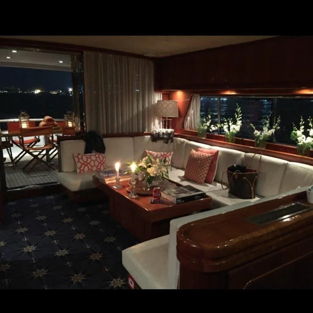 a living room with a couch and a table aboard M.I.S. MOONDANCE Yacht for Sale