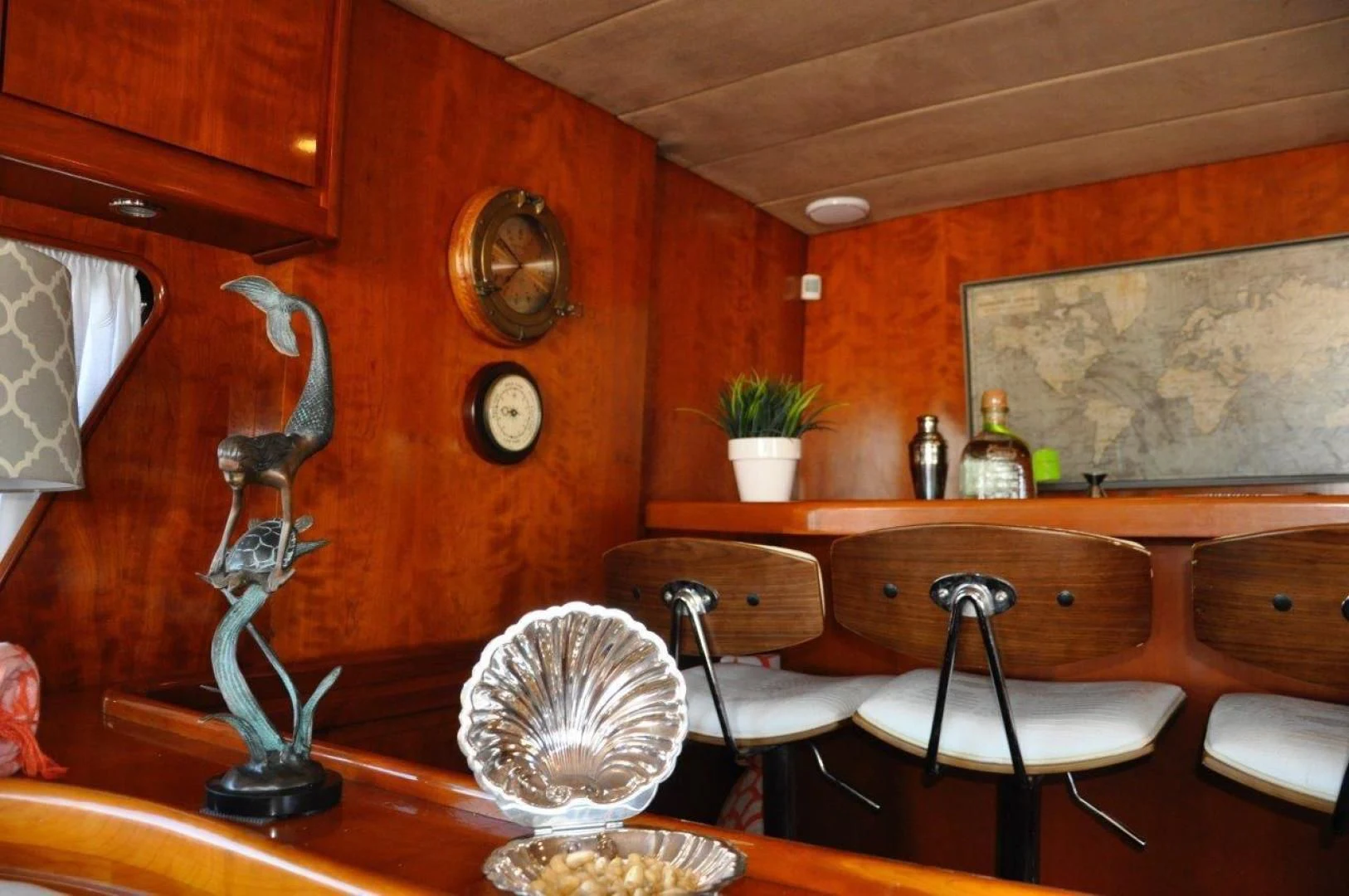 a kitchen with a table and chairs aboard M.I.S. MOONDANCE Yacht for Sale