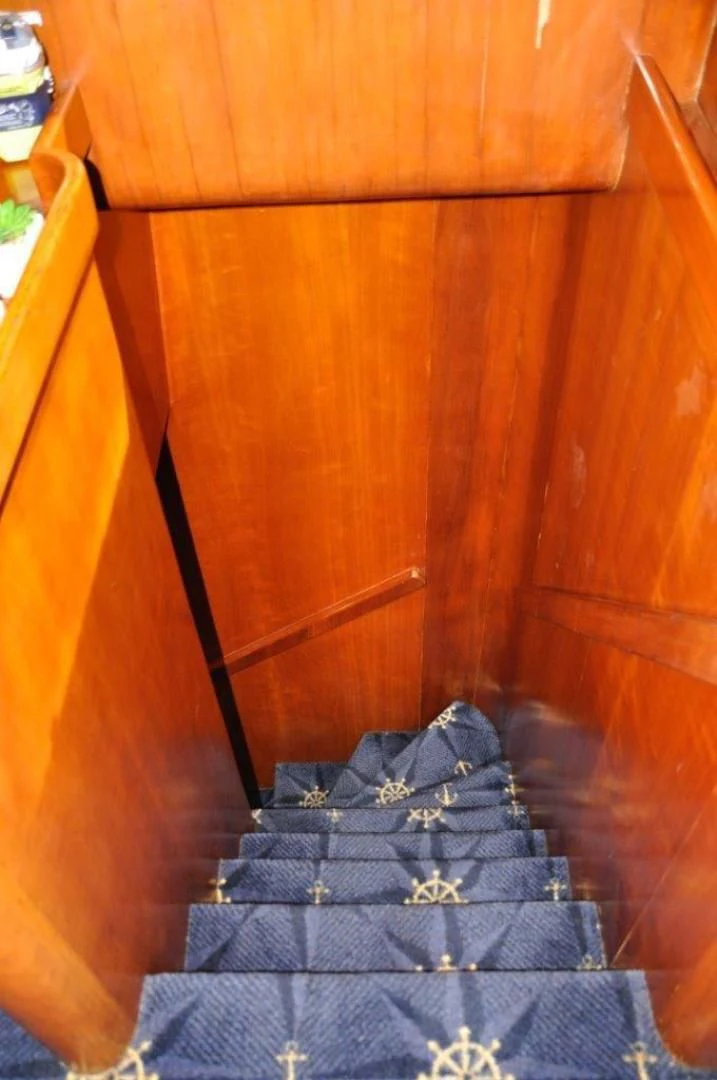 a black object on a wooden surface aboard M.I.S. MOONDANCE Yacht for Sale