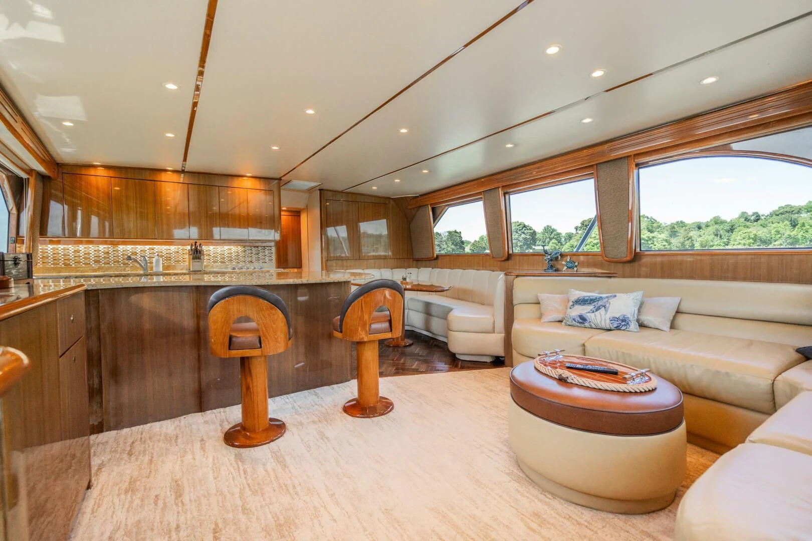 a living room with a couch and a table aboard W Yacht for Sale