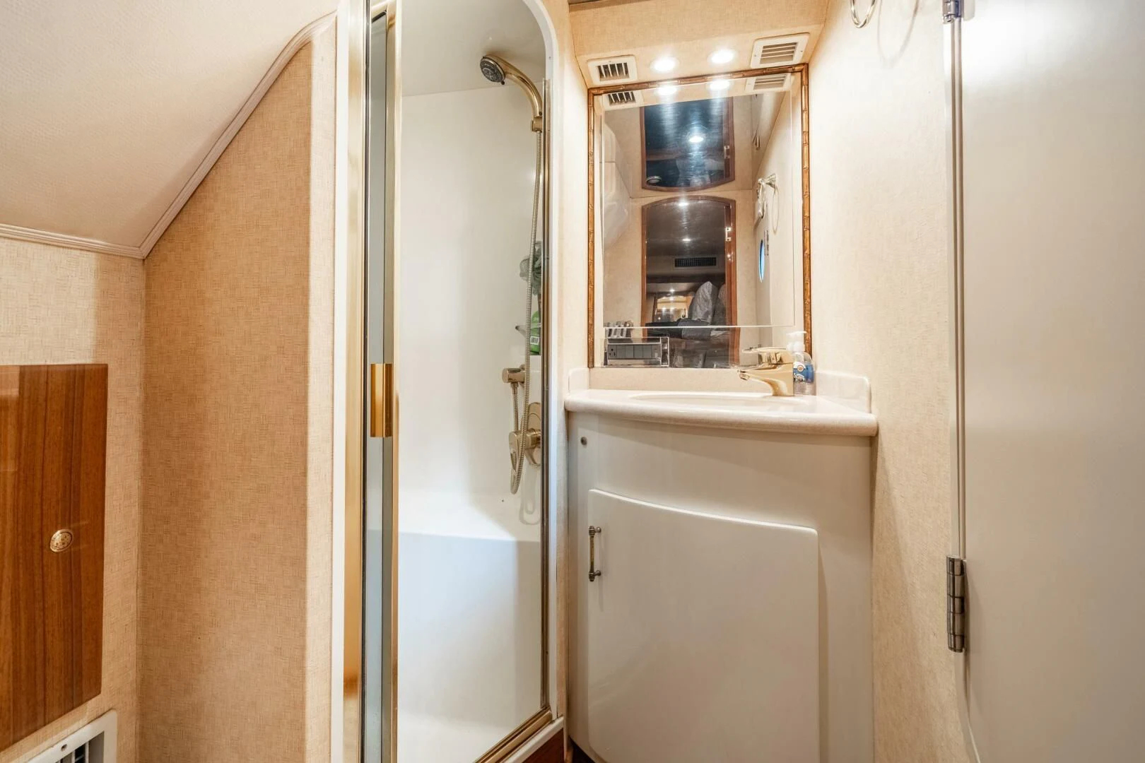 a bathroom with a glass shower aboard W Yacht for Sale