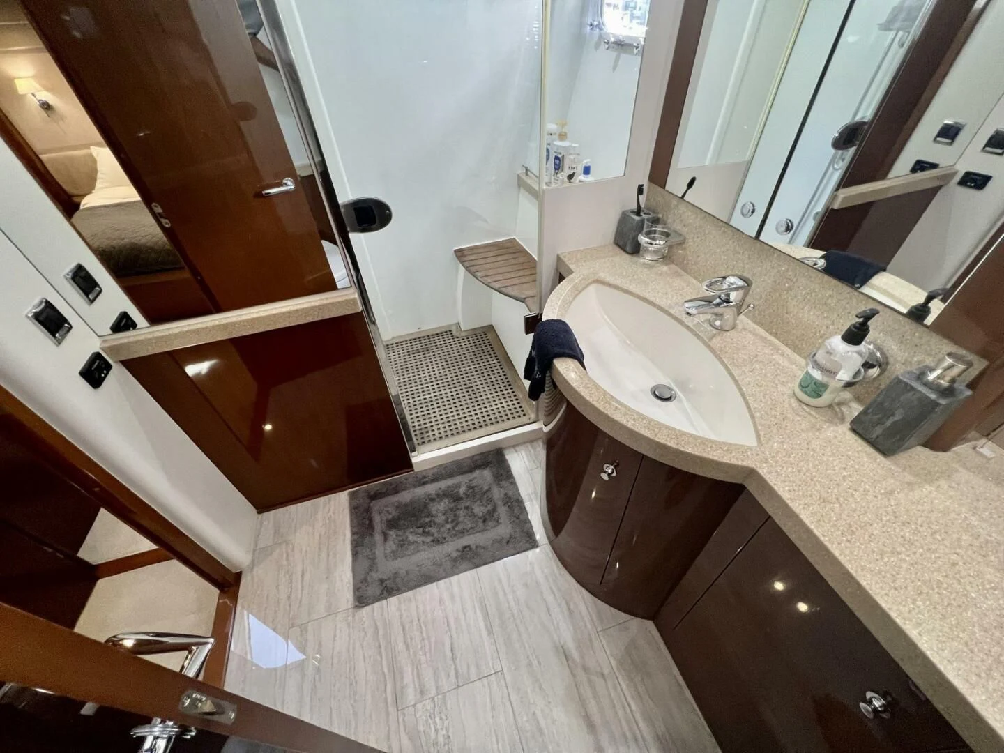 a bathroom with a sink and a mirror aboard W Yacht for Sale