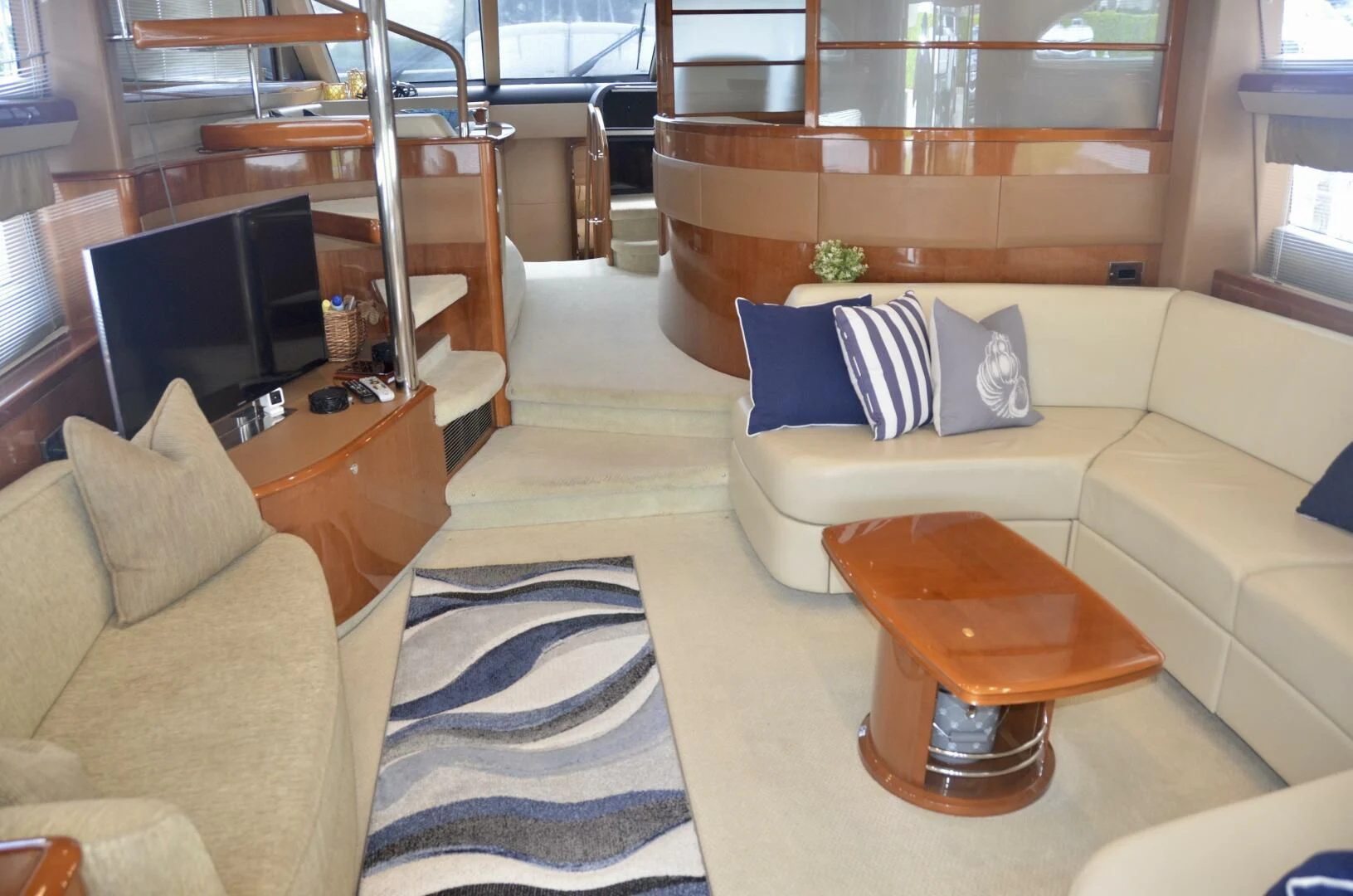 a living room with a couch and a coffee table aboard W Yacht for Sale