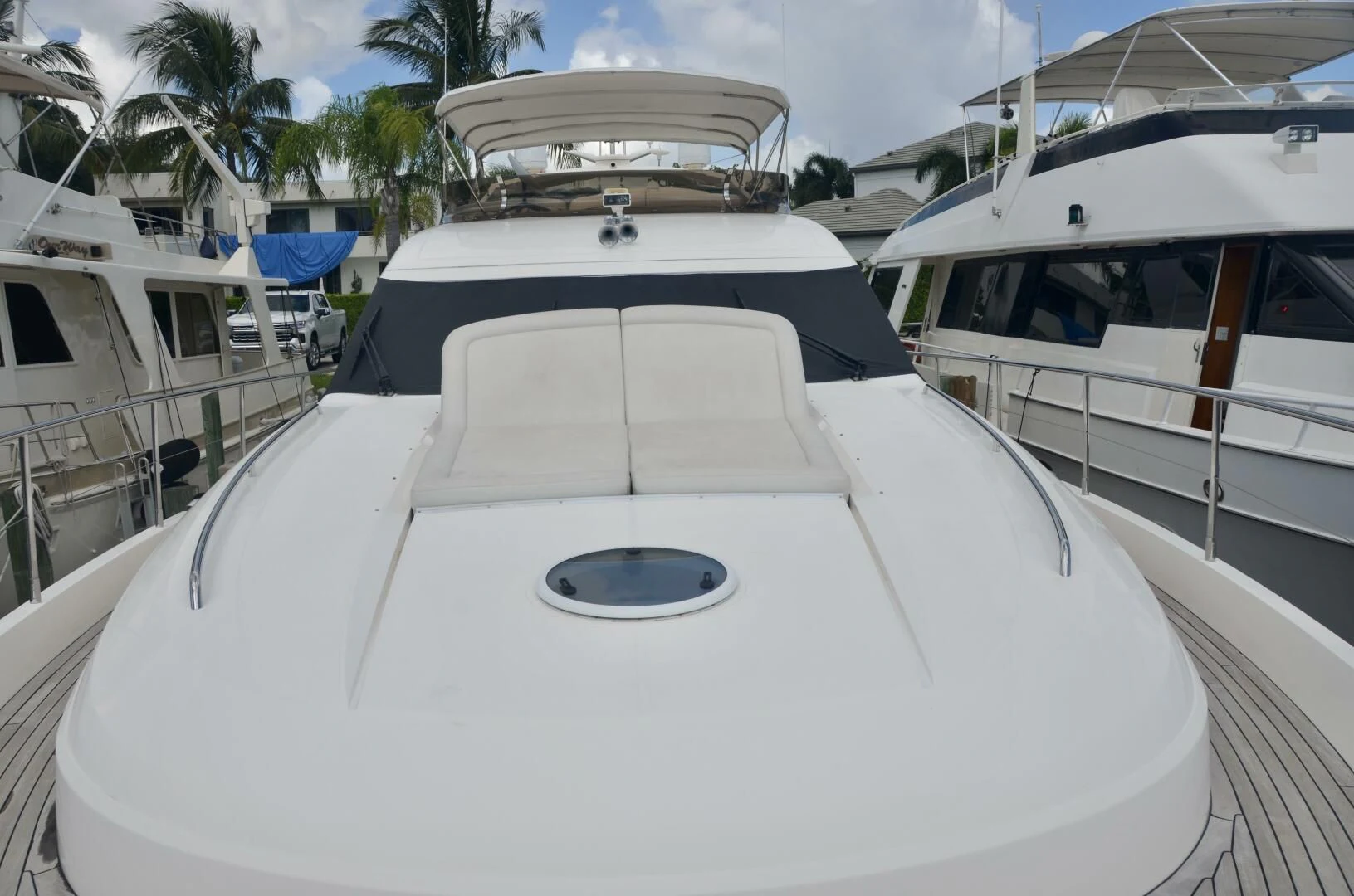 a white yacht in a harbor aboard W Yacht for Sale