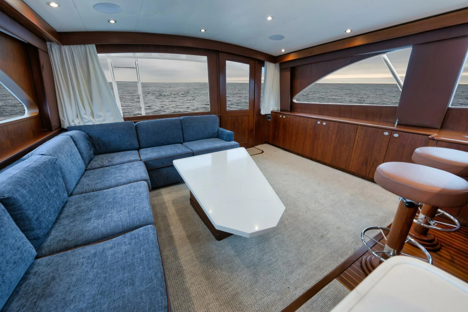 a living room with a couch and a table aboard W Yacht for Sale
