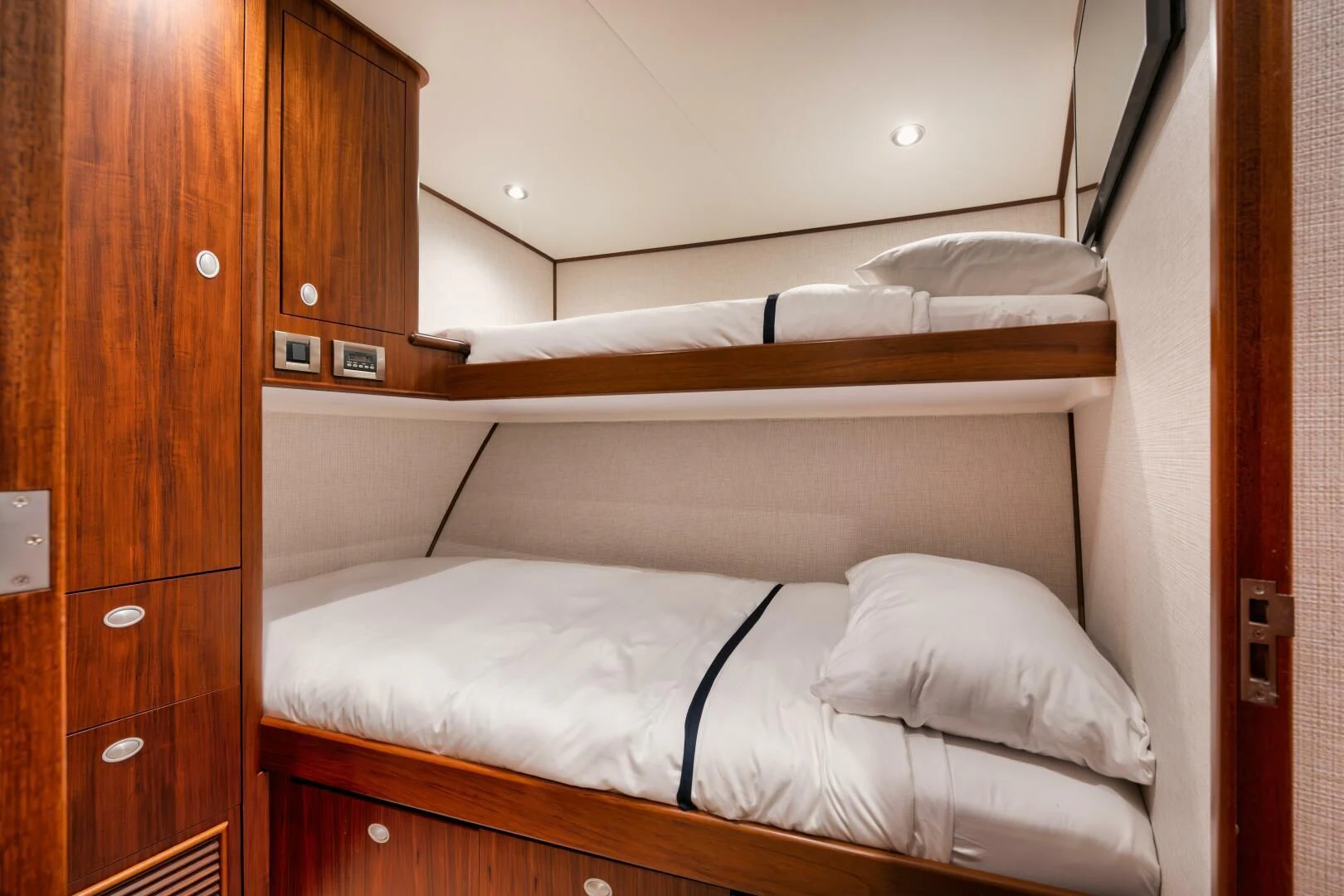 a bed with white sheets aboard W Yacht for Sale