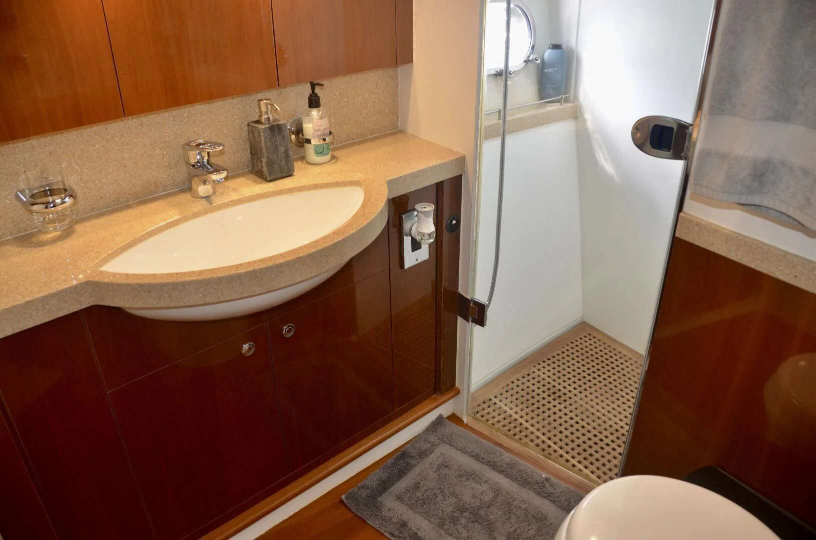 a bathroom with a sink and a mirror aboard W Yacht for Sale