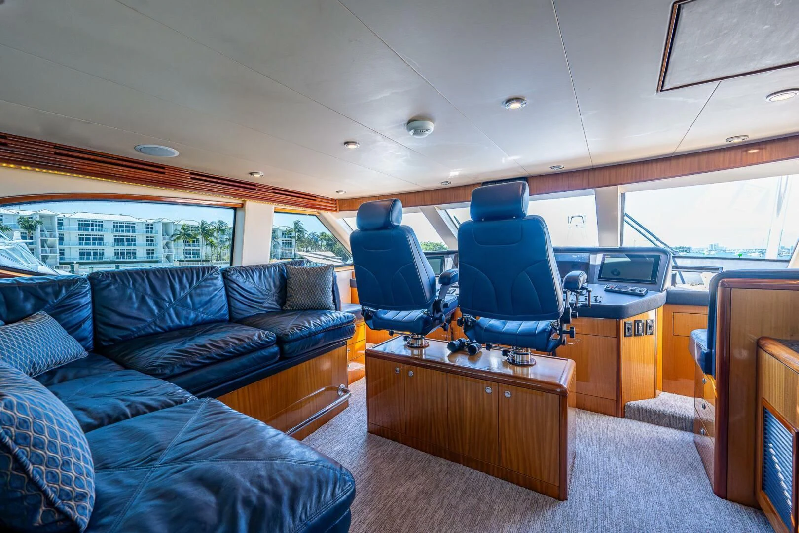 a van with a couch and a desk aboard W Yacht for Sale